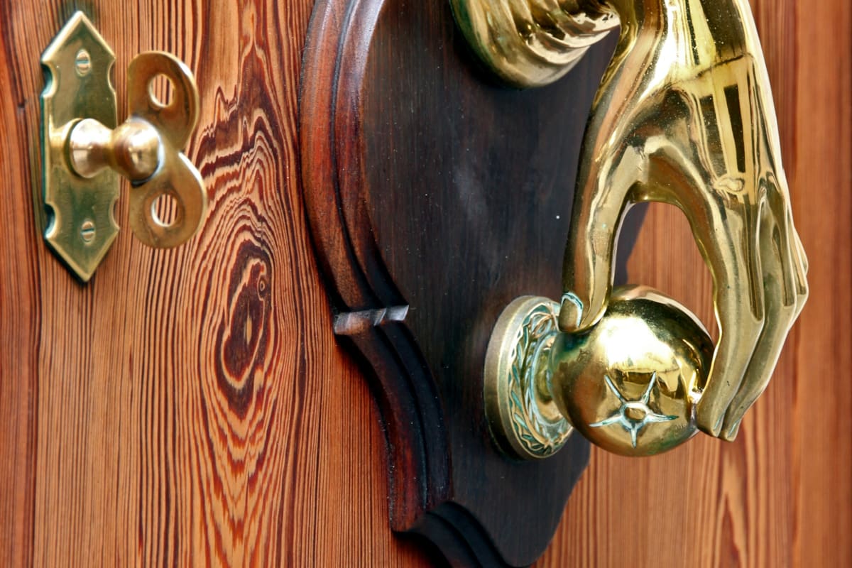 Brass door hardware on a wood door