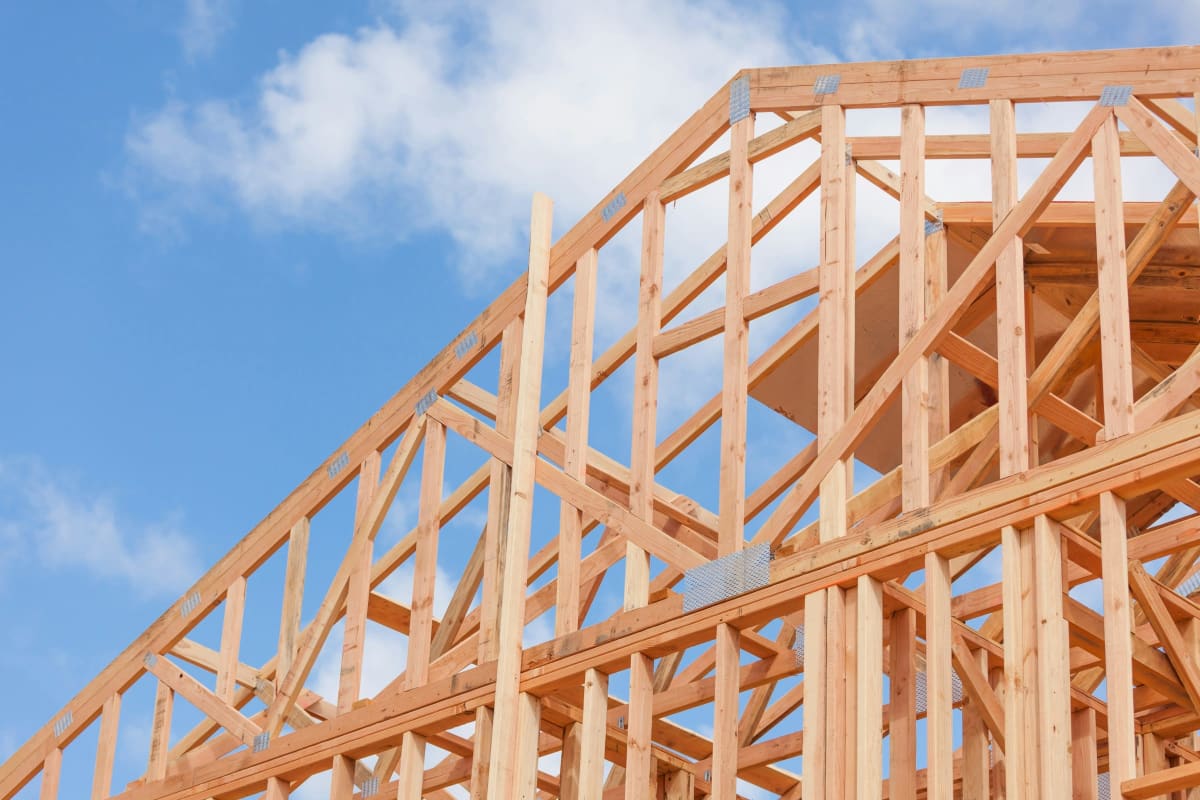 Roof trusses against a blue sky