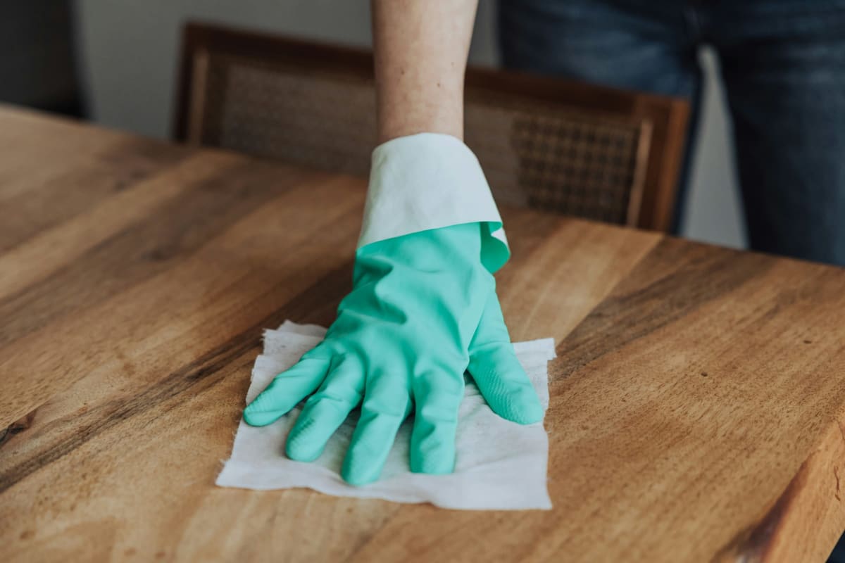 Wiping down a wood table
