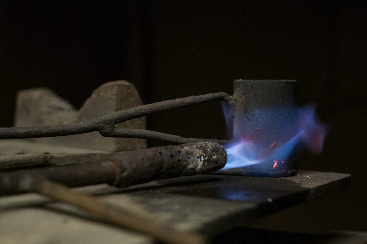 Blue torch flame heating metal