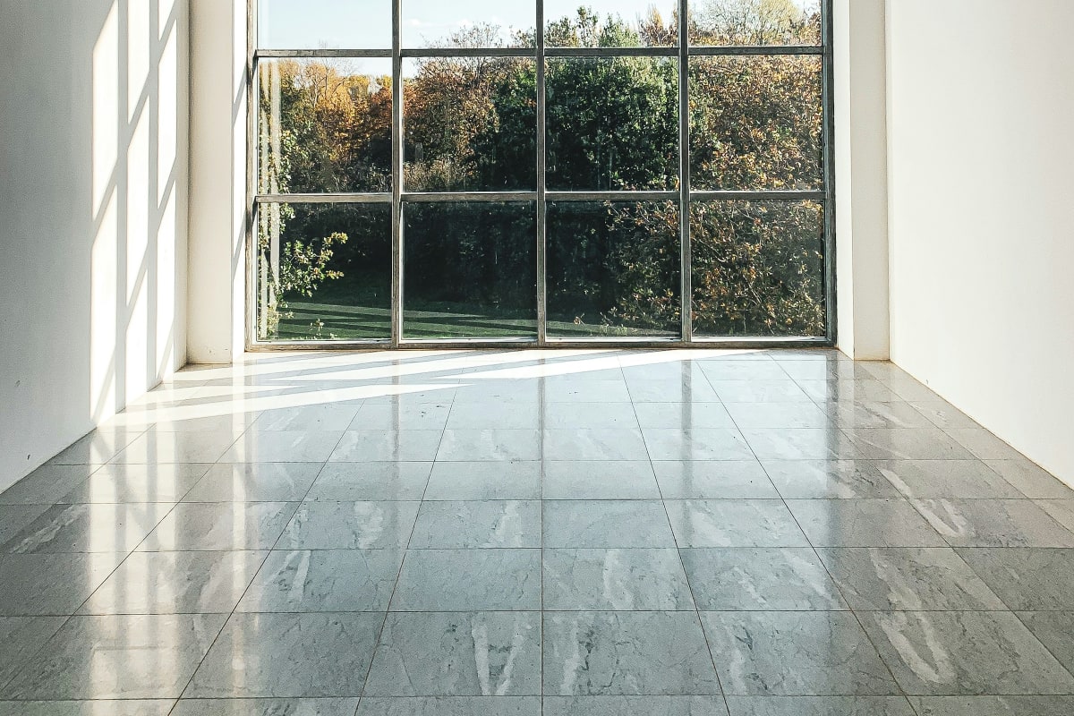 Tall steel-framed window in a bright room