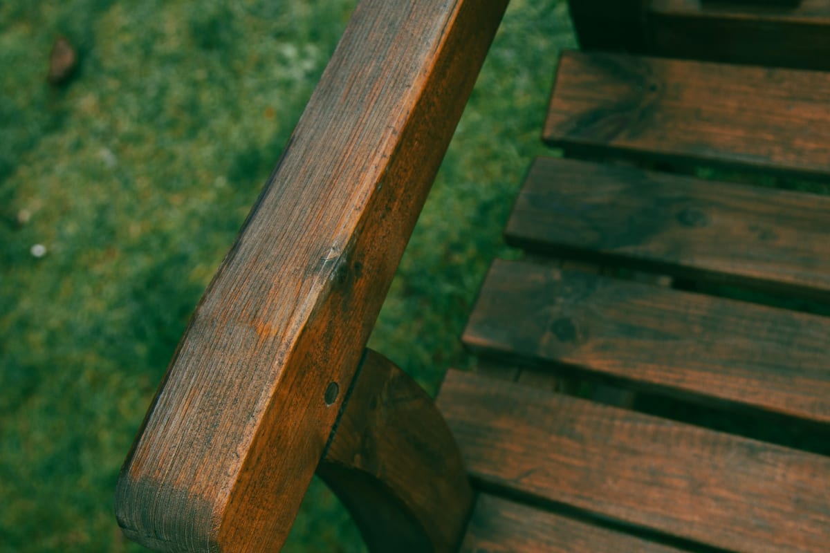 Stained wood bench on the lawn