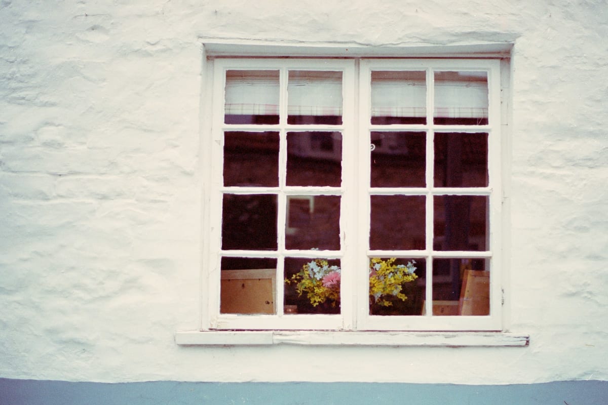 White-trimmed window on a white wall