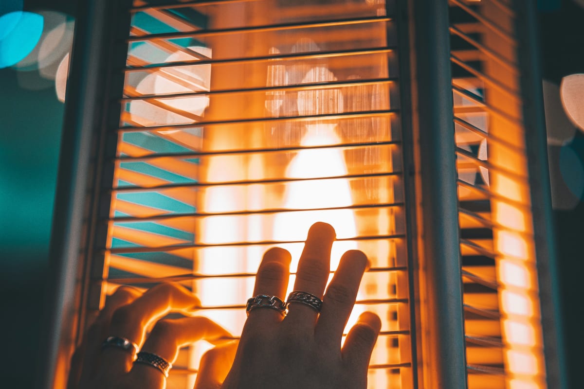 Warming hands at a heater