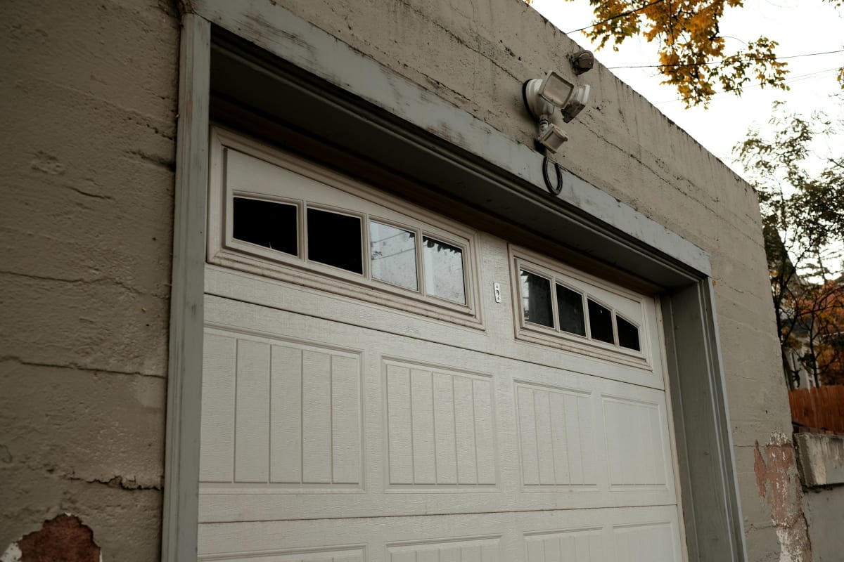White carriage-style garage door with windows