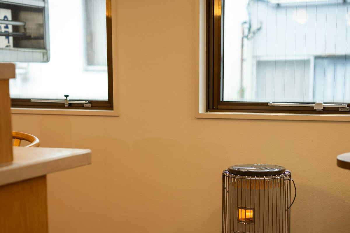 Portable heater warming a bright room