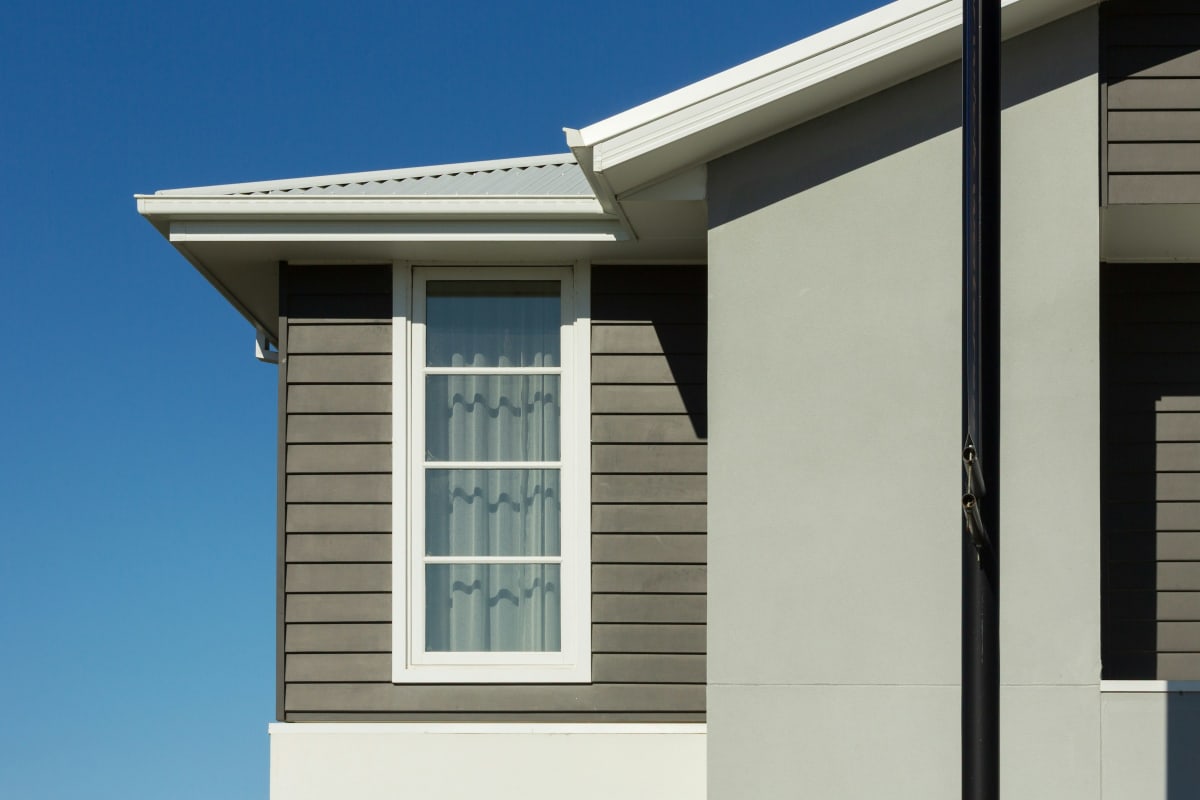 Lap siding beside a white-trimmed window