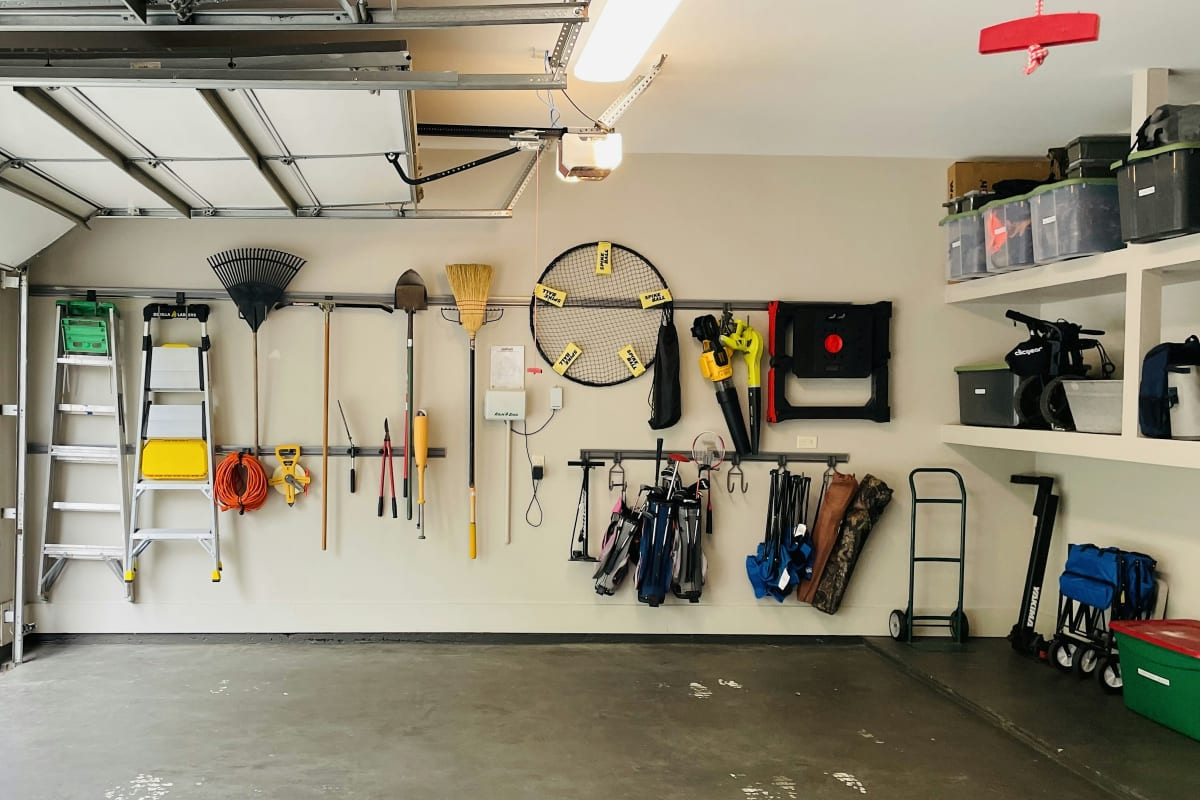 Organized garage with tools on the wall