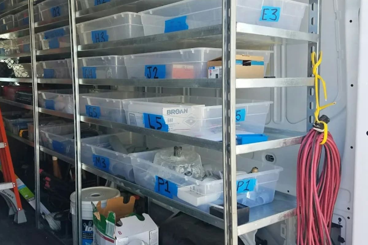 Labeled clear storage bins on shelves