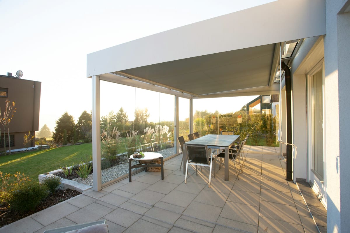 Modern pergola shading a patio dining table