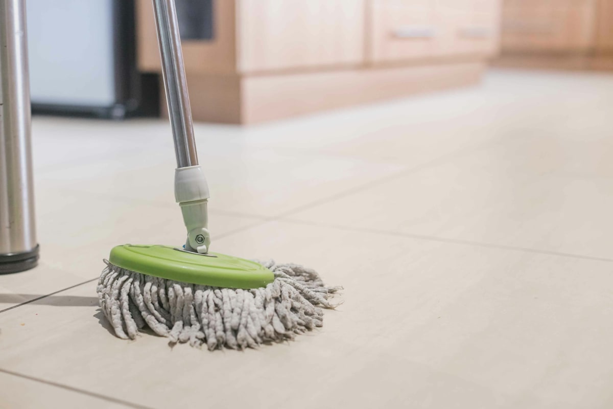 Mopping a light tile floor