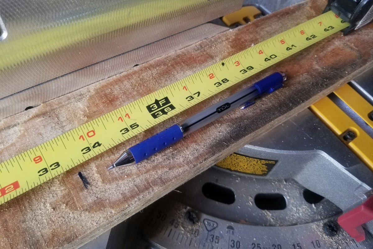 Pen resting on a tape measure at the saw