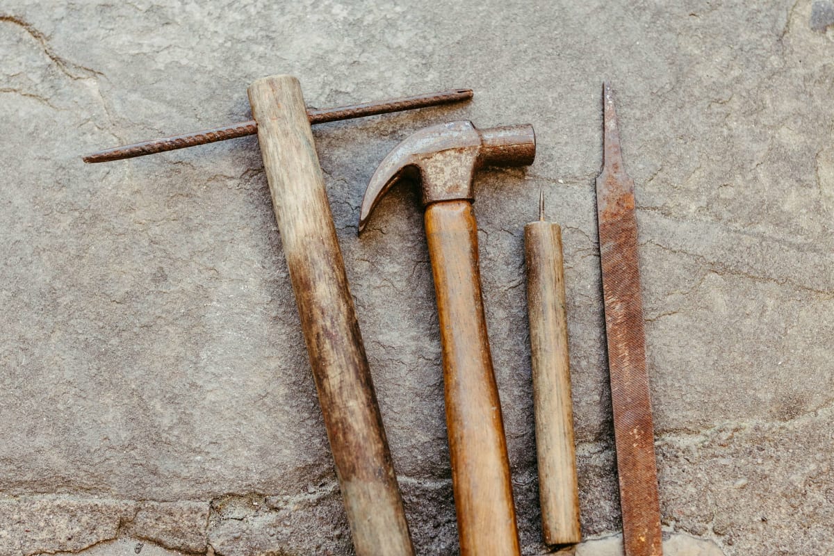 Hammers and tools on a stone slab