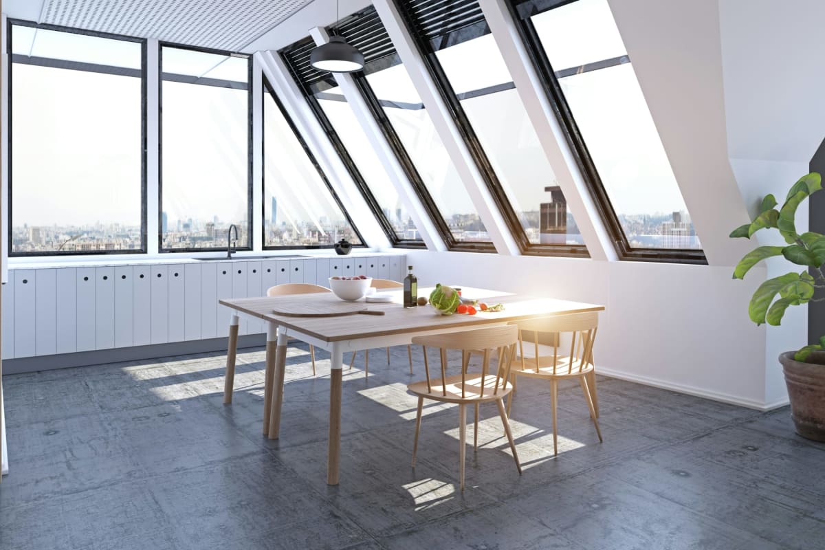 Bright attic kitchen under roof windows
