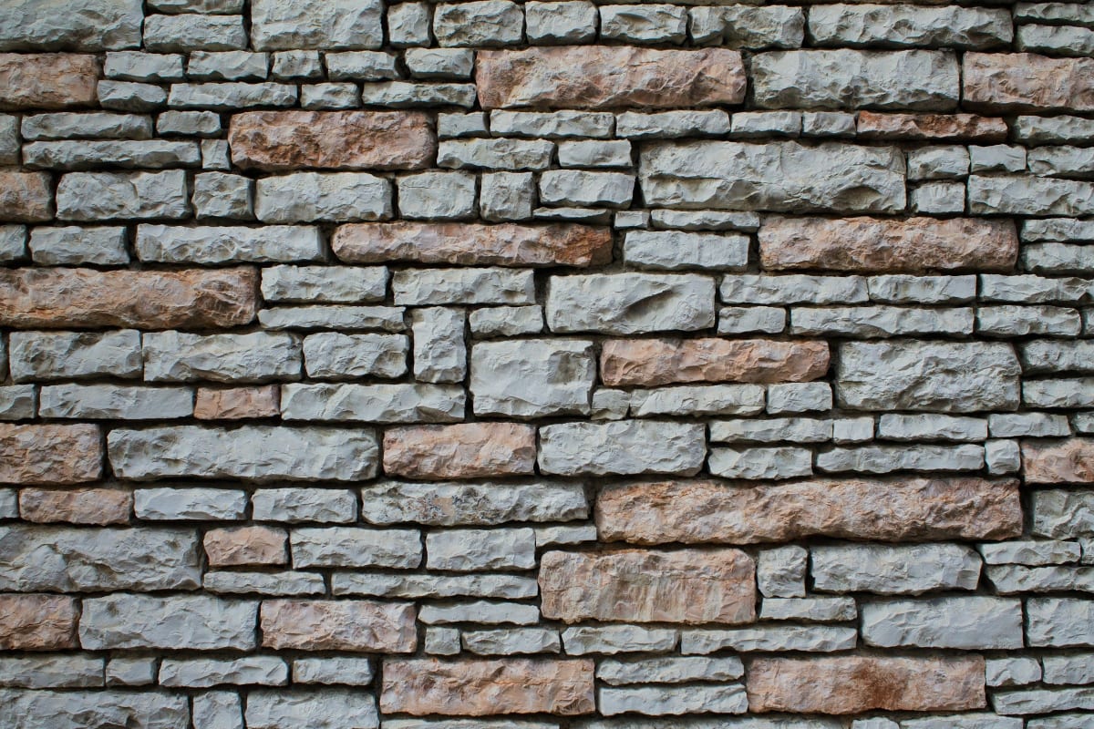 Stacked stone veneer wall