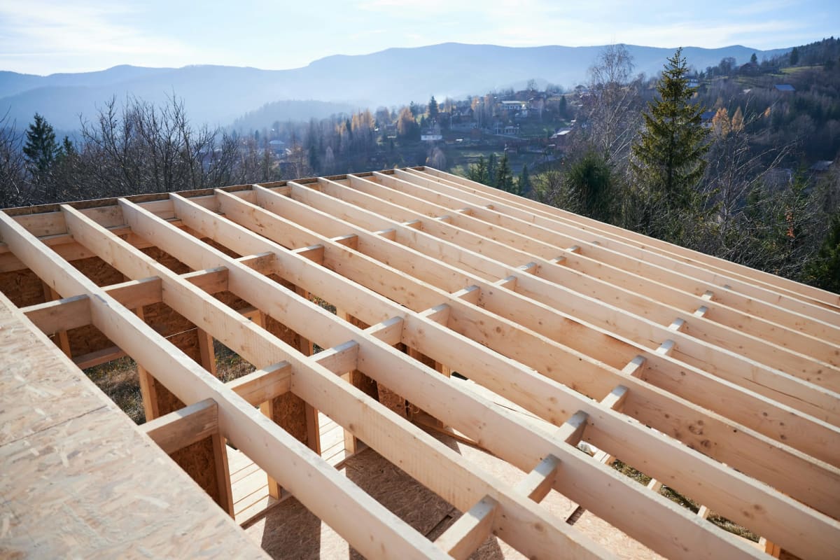 Engineered wood floor joists framed on a new home with a mountain view
