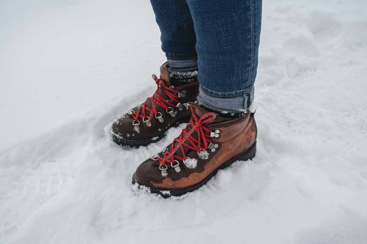 Hiking boots planted in fresh snow