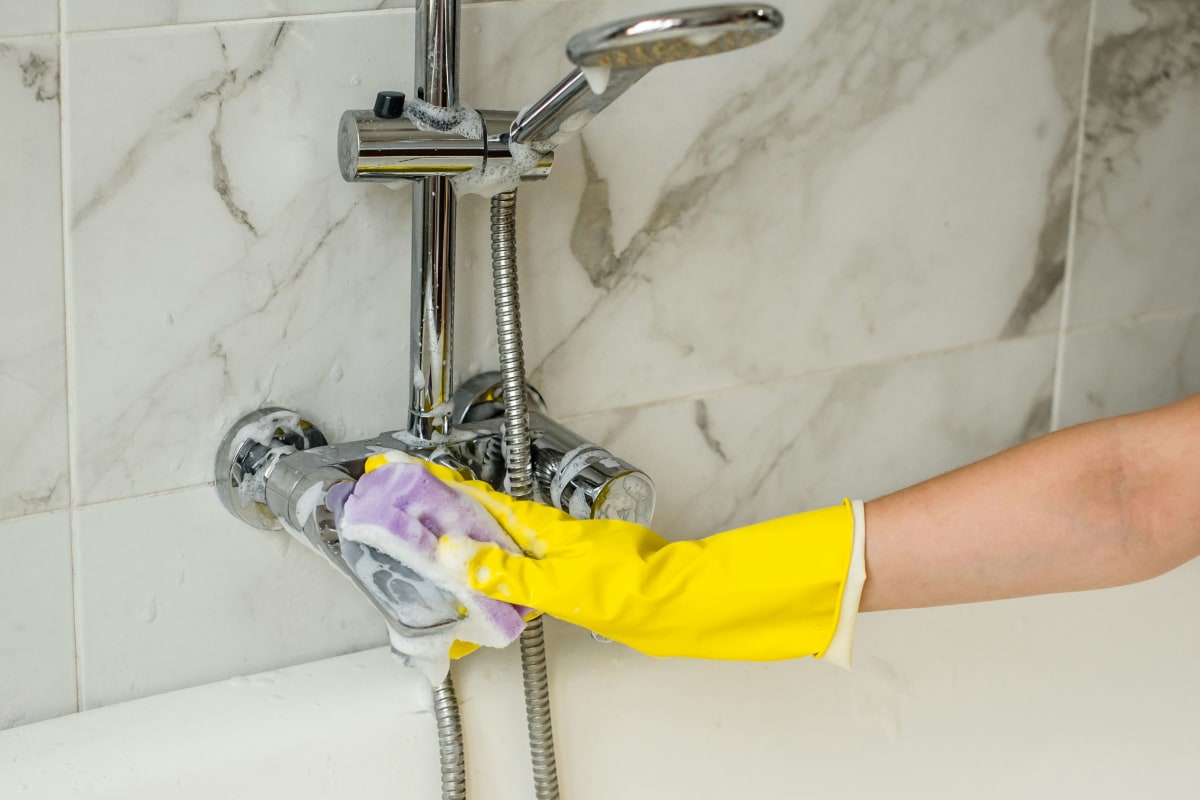 Cleaning a tub faucet