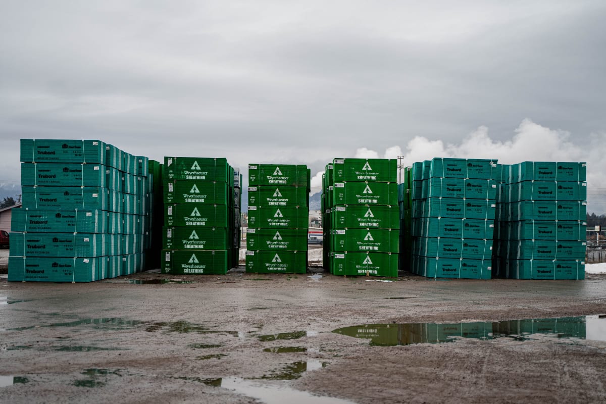 Weyerhaeuser-wrapped lumber bundles stacked in the WBC yard