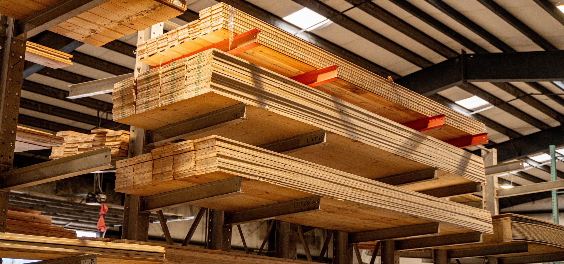 Lumber on cantilever racks with golden skylight