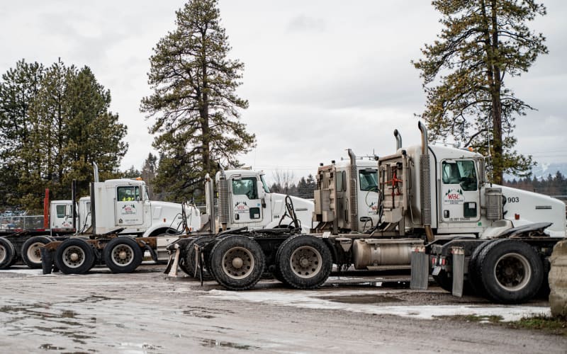 Fleet of WBC delivery trucks at the corporate yard in Kalispell