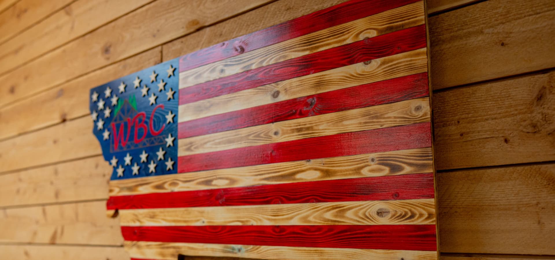 Montana-shaped wooden American flag with WBC logo