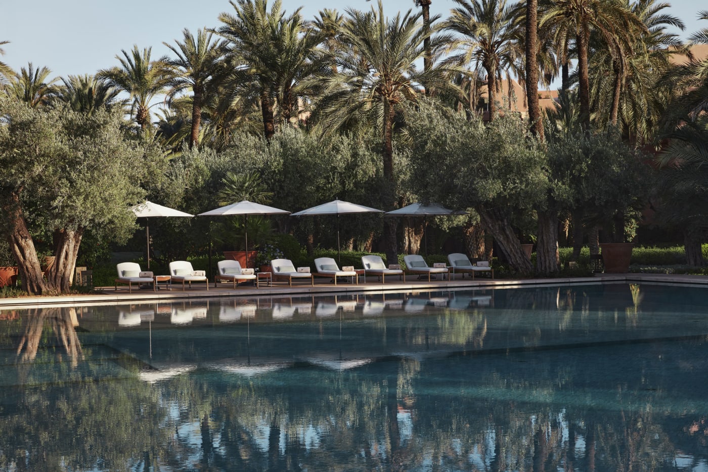 Outdoor pool at Royal Mansour Marrakech with palm trees