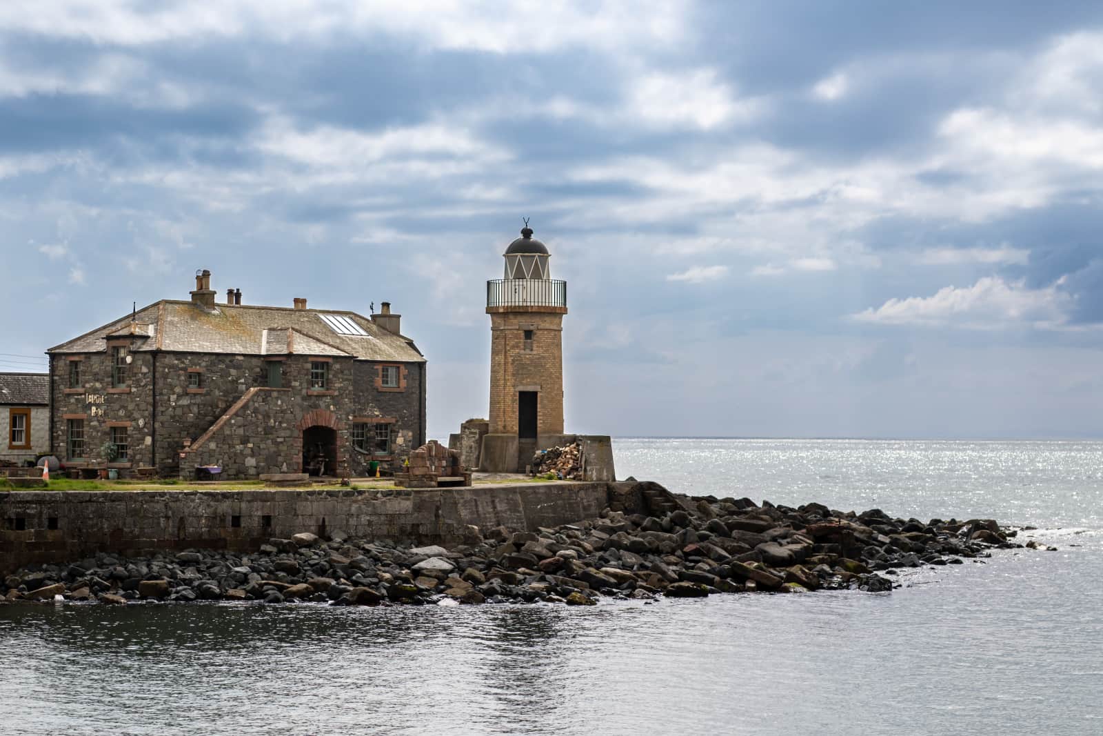 There’s something comforting about places built to withstand weather.
Stone walls, an old light, and the sea stretching out beyond them; all quietly carrying on.