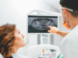 Dentist-with-OPG-X-Ray-300x225