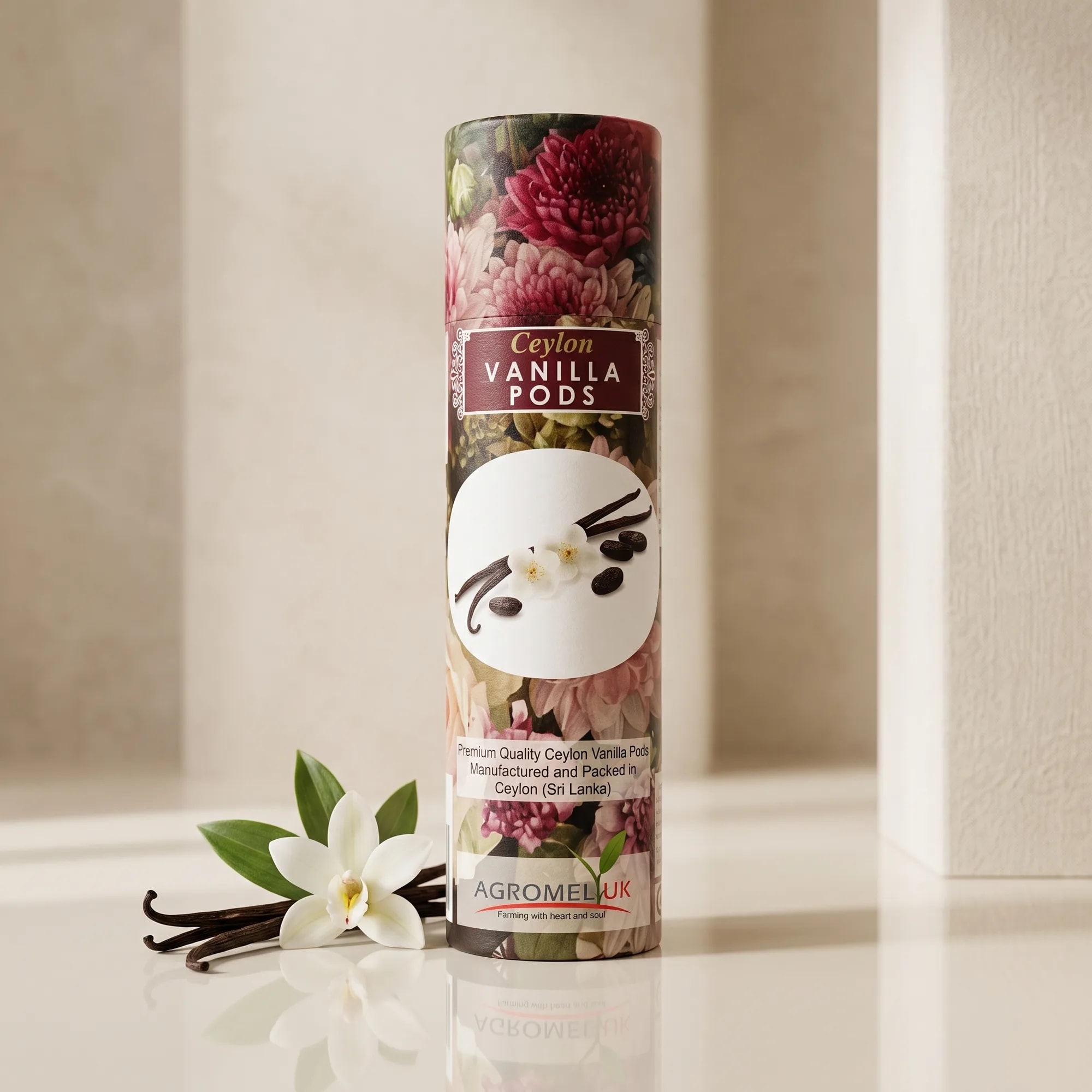 Ceylon Vanilla Pods 50g canister on a reflective glass surface — made in Sri Lanka, from Agromel UK