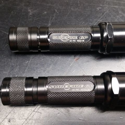 Surefire 6P. Both have led conversation. Older small fin logo is pre QR code, lage fin is post QR code production. One is momentary only tail cap and one is clicky tail cap.