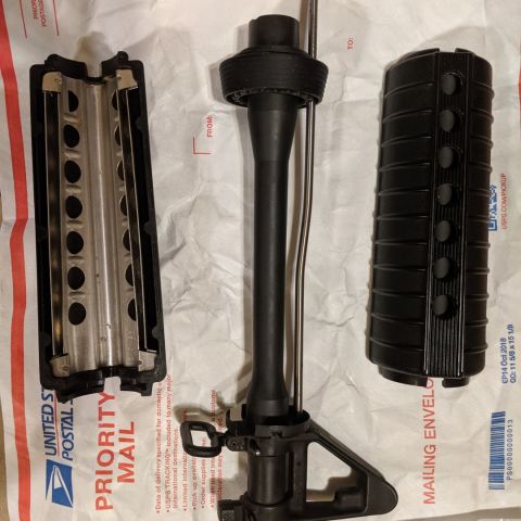 Colt 10.3" MK18 barrel. This came from Colt as a 10.3" with a factory installed FSB, it is not a cut down M4 barrel. CAGE code and "M P 5.56 NATO 1/7" marked, 06/18 date stamped. Delta ring, barrel nut, and gas tube are all Colt, as are the included M4 handguards. Less than 100 rounds through it (MK18s just aren't my thing), so it's in great shape. The ONLY things I need in trade are a Knights 99166/20214 FF RAS Medium, or a tanodized or "Patents Pending" marked PRI Gasbuster.