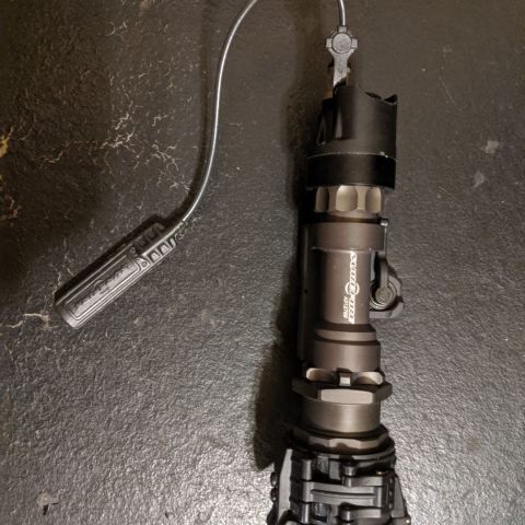 Surefire M952XM, like new. Comes with ARMS #17 mount, IR filter, and tape switch.