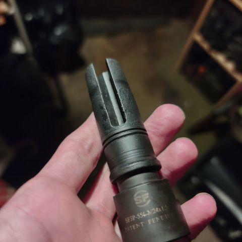 Discontinued (as far as I can tell) Surefire 3-prong for AK-74/101/102/105. 24mm threads for threading on your FSB, filthy, but still in great functional condition.