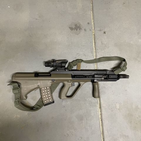 AUG CQC with 18” chrome lined barrel. Also includes; manticore arms rear QD pin, Corvus defensio brass deflector, bfg padded sling, ratworx 20/20 sear, surefire 3 prong and OE tulip fh both are threaded in 13x1 LH so no funky adapter is needed, standard gas plug and suppressor gas plug, 2 30 round mags, 1 42 round mag, and steyr bag. I put 1 mag through it. I have a few more unopened 30 round mags I can add for 30 each. Acog is not included.