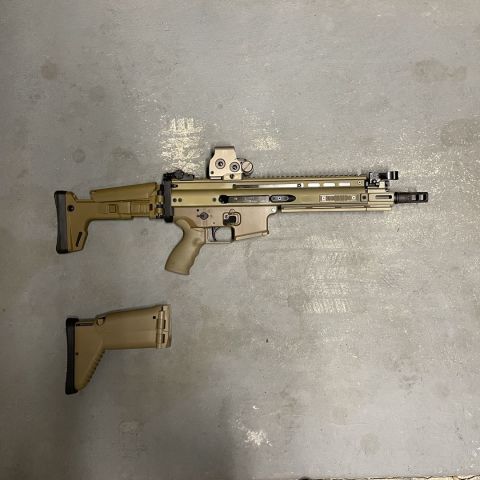 10” Belgian Scar 16. Comes with KDG Stock, Scar stock, mototech buffer pad, geissele trigger, PMM gas jets in 1.8mm, 1.7mm, and oem jet that came with 10” barrel, standard picatinny rails, FDE PMM MLOK Rails, FDE PMM Rail deletes, FDE PMM MLOK Rail extension, Fde ergo grip, surefire sfmb, KDG charging handle. Currently on a form 1, can be removed from NFA or be put on a form 3. 200 rounds through the receiver, 50 through 10” barrel. 