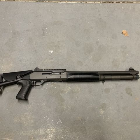 Benelli M4 with 3 pos stock/buffer tube and 7+1 extension. Has some safe marks, but in great shape. 