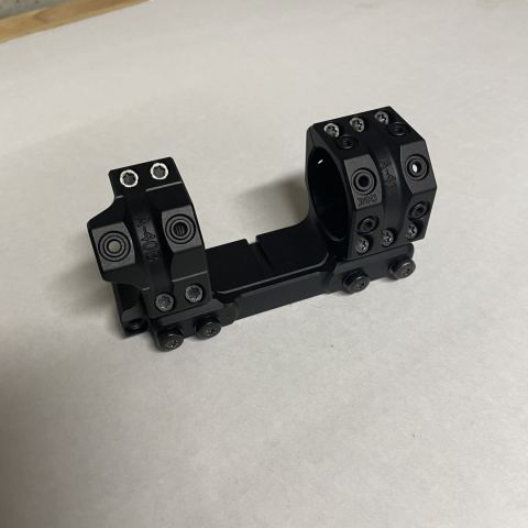 SPUHR SP-4036 never mounted, comes with mount and leveling wedge not shown. This was made for the Schmidt & Bender 5-20 ultra short, but will work with any 34mm tube. It is 1.35mm high and has a built in bubble level. 