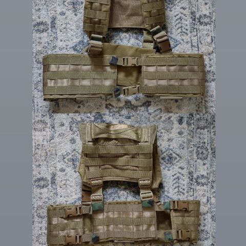 Eagle industries H-harness. Modified by HubCity Outdoors. New surplus condition. The padding on the front straps has been reduced to come just over the shoulder. The front connection points have been reduced to a single 1.5" clip. The back panel attached to the side panels with swift clips. The rear harness molle has been reduced to allow for more adjustment. The purpose of the mods is to allow the harness to be worn high on the chest, or low on the hips.
