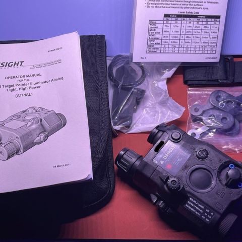 New unissued Full Power (100mw) La5B. This unit is absolutely baby fresh and come with the full kit.   25mw red visible laser and 100mw IR illuminator. 