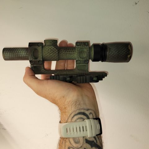 Leopold VX3 in American Defense Recon QD mount. The reticle is a plain old crosshair, about 3-4" of eye relief, 1.5-5x. I paid 300 for the scope a few years ago and have no use for it anymore. 
