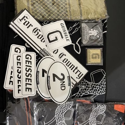 Geissele Swag Pack. 4 shot show bandannas of different colors. 2 patches, khaki neck covering, and ton of slaps