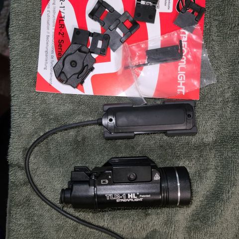 Selling a TLR-1 HL with all of the adapter plates. It also comes with Remote Door/Switch Assembly (already installed) original switch assembly and pressure switch. The pressure switch allows for momentary and strobe. Barely used and comes with a working battery. 