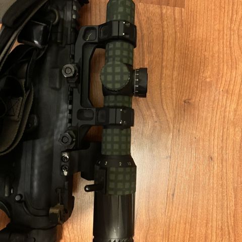 Eotech Vudu 1-6 FFP with Geissele 1.93 Mount.  Wrapped in DNC, comes off easy. 