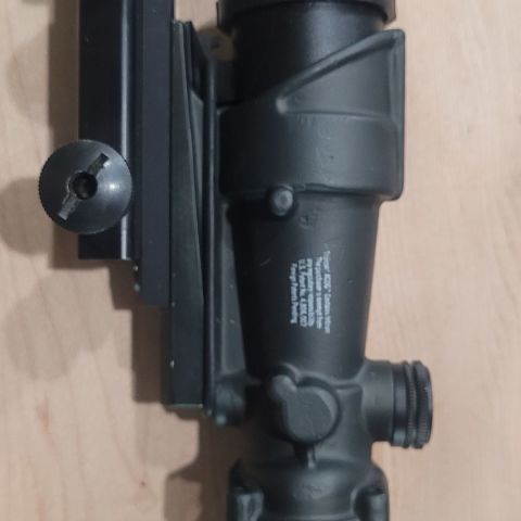 Trijicon TA01 red crosshair.