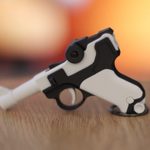 Pistol key chain and holster