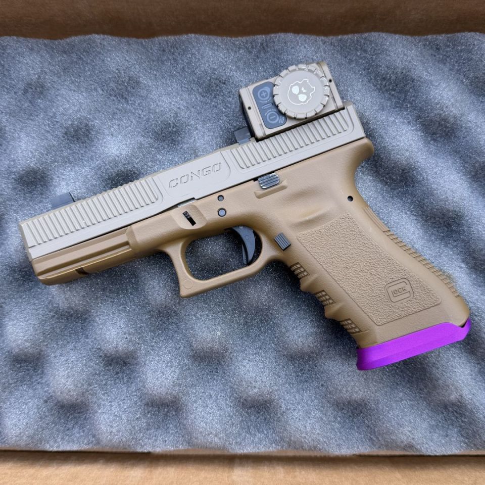 Image 1 - Congo Glock comped 