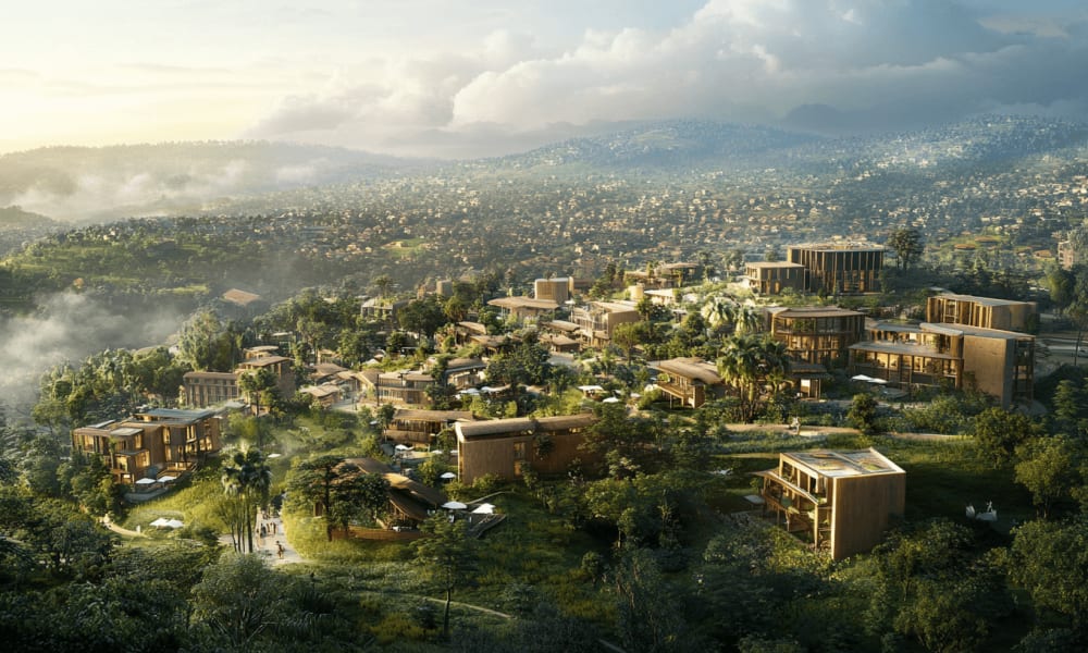 A modern hillside community with multiple contemporary buildings surrounded by lush greenery under a cloudy sky.