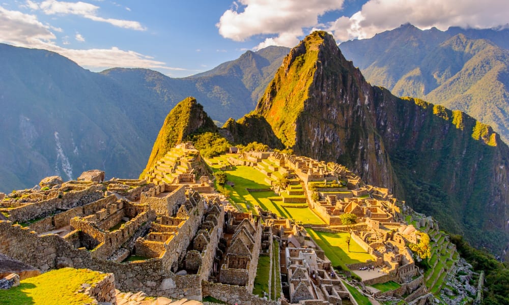 Machu Picchu, an ancient Inca city nestled high in the Peruvian Andes with terraces and stone structures.