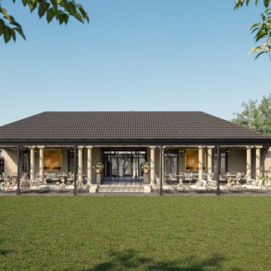 Single-story house with a large covered patio furnished with tables and chairs, surrounded by green lawn and framed by flowering branches under a clear blue sky.